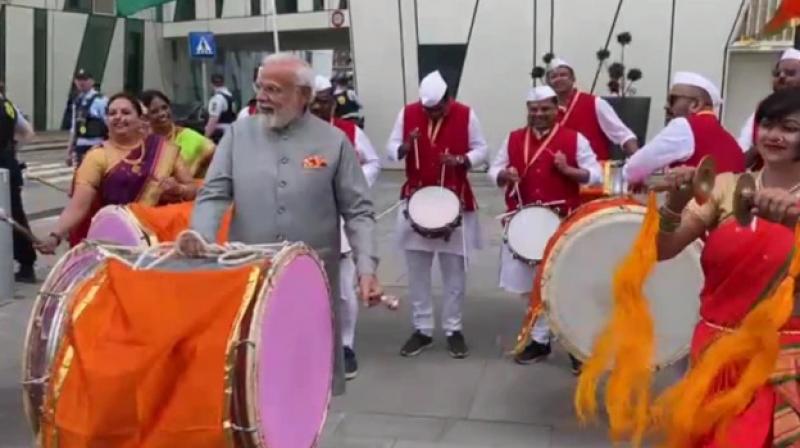 PM Modi tries his hand on a drum in denmark PM Modi tries his hand on a drum in denmark