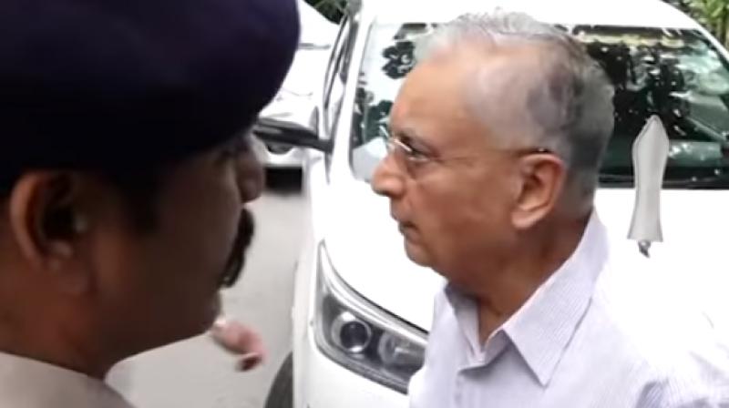 An elderly man stops Karnataka Chief Minister Siddaramaiah's car.