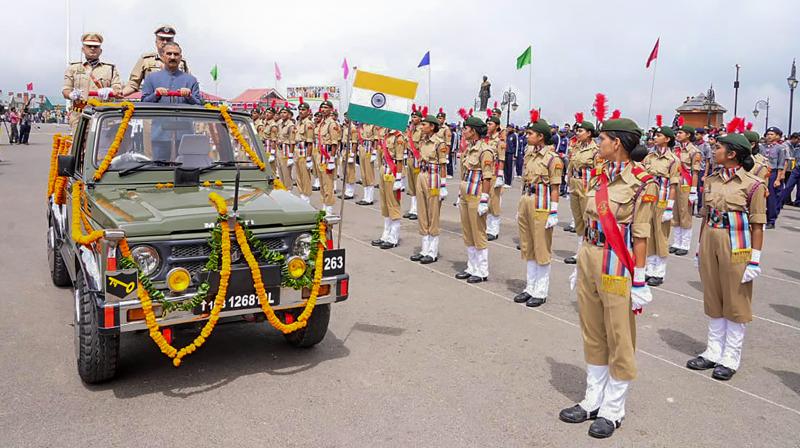 Shimla: Himachal Pradesh Chief Minister Sukhvinder Singh Sukhu inspects the Guard of Honour during the celebrations of the 77th Independence Day, at Ridge Ground in Shimla, Tuesday, Aug. 15, 2023. (PTI Photo)
