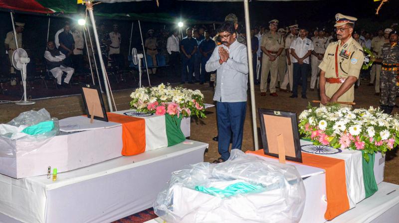 Ranchi: Jharkhand Chief Minister Hemant Soren pays tributes to martyrs Gautam Rana and Amit Tiwari, in Ranchi, Tuesday, Aug 15, 2023. Both personnel were killed in a cross encounter with Left Wing Extremists (LWE) at Tonto forest area in Chaibasa town. (PTI Photo) Ranchi: Jharkhand Chief Minister Hemant Soren pays tributes to martyrs Gautam Rana and Amit Tiwari, in Ranchi, Tuesday, Aug 15, 2023. Both personnel were killed in a cross encounter with Left Wing Extremists (LWE) at Tonto forest area in Chaibasa town. (PTI Photo)