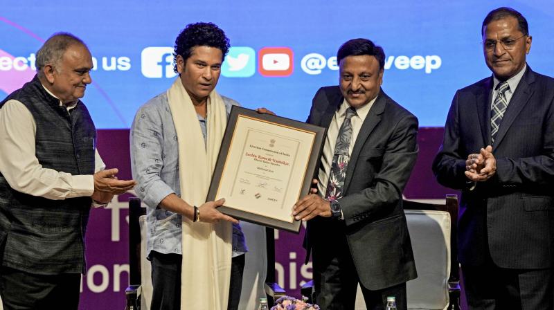 New Delhi: Chief Election Commissioner (ECI) Rajiv Kumar, and other commissioners Arun Goel and Anup Chandra Pandey with cricket legend Sachin Tendulkar during a programme where the latter was recognised as 'National Icon' of the ECI to encourage higher voter turnout, in New Delhi, Wednesday, Aug. 23, 2023. (PTI Photo/Vijay Verma) New Delhi: Chief Election Commissioner (ECI) Rajiv Kumar, and other commissioners Arun Goel and Anup Chandra Pandey with cricket legend Sachin Tendulkar during a programme where the latter was recognised as 'National Icon' of the ECI to encourage higher voter turnout, in New Delhi, Wednesday, Aug. 23, 2023. (PTI Photo/Vijay Verma)