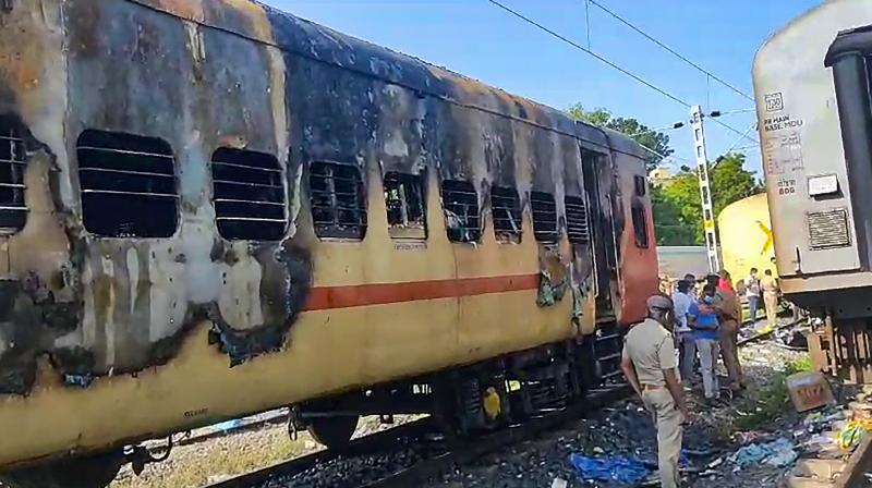 Madurai: Security personnel and other officials at the spot after a fire broke out in a coach of a train at Madurai railway station, Saturday, Aug. 26, 2023. At least 10 people were killed, according to officials. (PTI Photo)