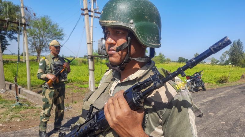 Jammu: Border Security Force (BSF) personnel stand guard near India-Pakistan border in the Arnia sector, on the outskirts of Jammu, Wednesday, Oct. 18, 2023. Two BSF personnel suffered gunshot injuries in a firing incident along the border on Tuesday. (PTI Photo)(PTI10_18_2023_000069A)