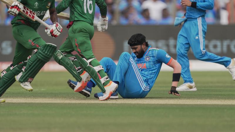 Pune: India's Hardik Pandya reacts after he suffered an injury during the ICC Men's Cricket World Cup 2023 match between India and Bangladesh, at Maharashtra Cricket Association Stadium in Pune, Thursday, Oct. 19, 2023. (PTI Photo/Kunal Patil)