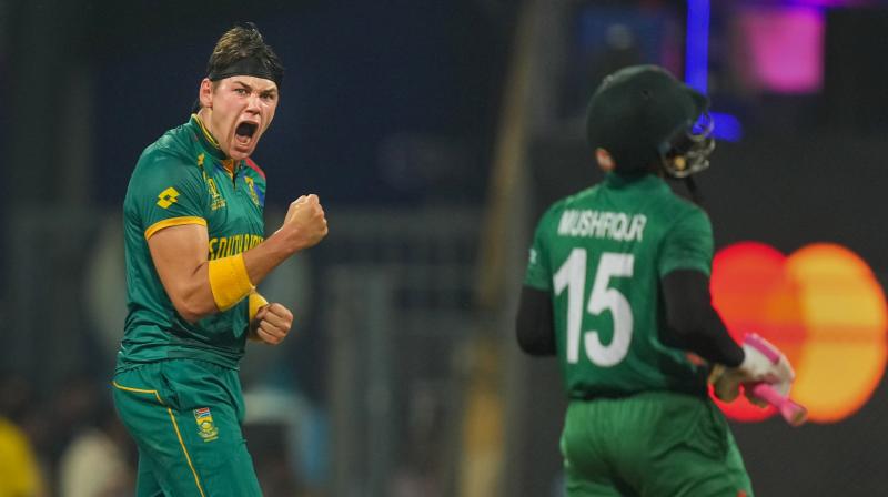 Mumbai: South Africa’s Gerald Coetzee celebrates the wicket of Bangladesh’s Mushfiqur Rahim during the ICC Men’s Cricket World Cup 2023 match between Bangladesh and South Africa, in Mumbai, Tuesday, Oct. 24, 2023. (PTI Photo/Shashank Parade) Mumbai: South Africa’s Gerald Coetzee celebrates the wicket of Bangladesh’s Mushfiqur Rahim during the ICC Men’s Cricket World Cup 2023 match between Bangladesh and South Africa, in Mumbai, Tuesday, Oct. 24, 2023. (PTI Photo/Shashank Parade)