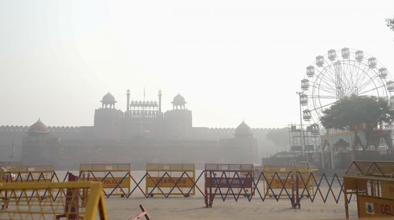 Delhi Pollution : Red Fort engulfed in smog, in New Delhi, Monday, Nov. 6, 2023. Pollution levels in Delhi-NCR on Monday morning were recorded around seven to eight times above the government-prescribed safe limit. (PTI Photo/Shahbaz Khan) Delhi Pollution : Red Fort engulfed in smog, in New Delhi, Monday, Nov. 6, 2023. Pollution levels in Delhi-NCR on Monday morning were recorded around seven to eight times above the government-prescribed safe limit. (PTI Photo/Shahbaz Khan)