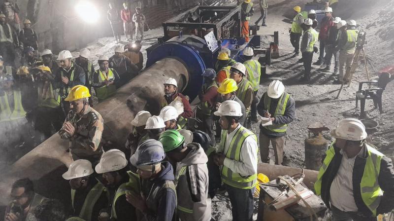 Uttarkashi: Rescue and relief operations underway after a portion of a tunnel under construction between Silkyara and Dandalgaon on the Brahmakhal-Yamunotri national highway collapsed, in Uttarkashi district, Friday, Nov. 17, 2023. (PTI Photo) Uttarkashi: Rescue and relief operations underway after a portion of a tunnel under construction between Silkyara and Dandalgaon on the Brahmakhal-Yamunotri national highway collapsed, in Uttarkashi district, Friday, Nov. 17, 2023. (PTI Photo)