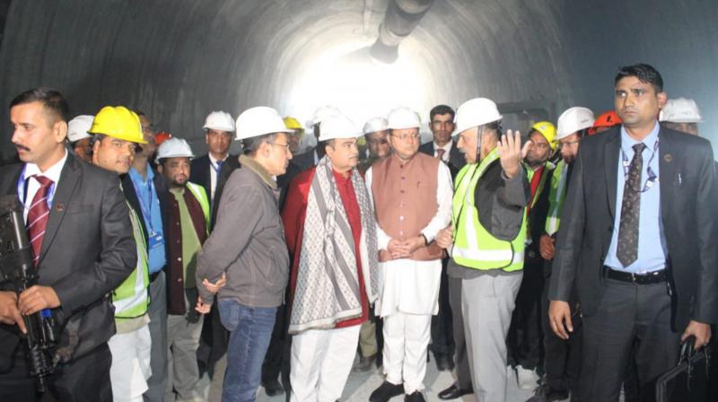 Uttarkashi: Union Minister for Road Transport and Highways Nitin Gadkari and Uttarakhand Chief Minister Pushkar Singh Dhami review the rescue operation after a portion of an under-construction tunnel between Silkyara and Dandalgaon on the Brahmakhal-Yamunotri national highway collapsed, in Uttarkashi district, Sunday, Nov. 19, 2023. (PTI Photo)