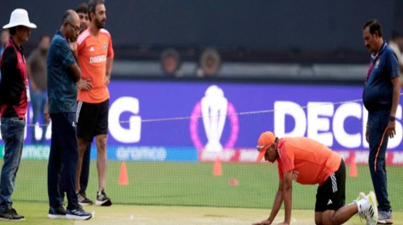 File Photo of Rahul Dravid examining the pitch.