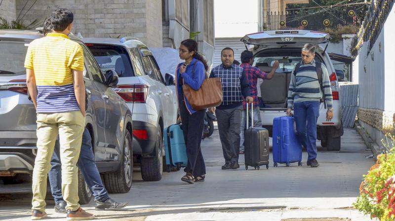 Ranchi: Income Tax department officials during a raid on the residence of Congress MP Dhiraj Prasad Sahu in connection with a disproportionate assets case, in Ranchi, Sunday, Dec. 10, 2023. (PTI Photo)