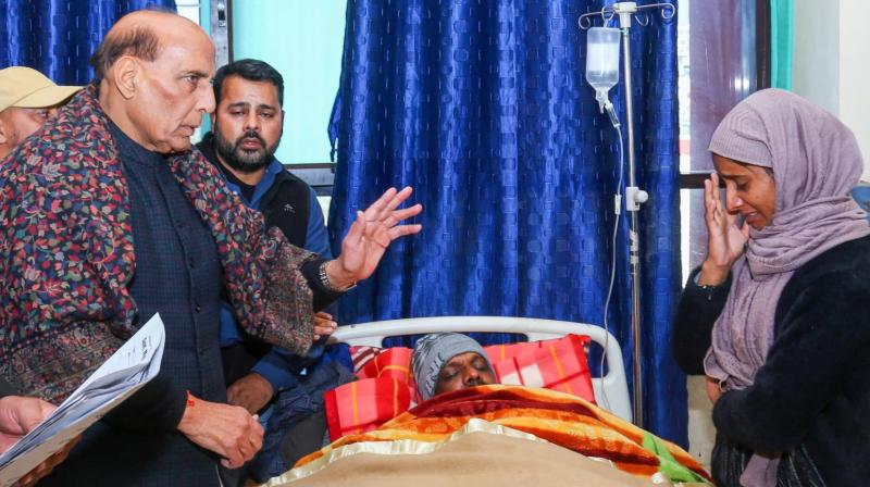 The Defense Minister Rajnath Singh with one of victim family. The Defense Minister Rajnath Singh with one of victim family.
