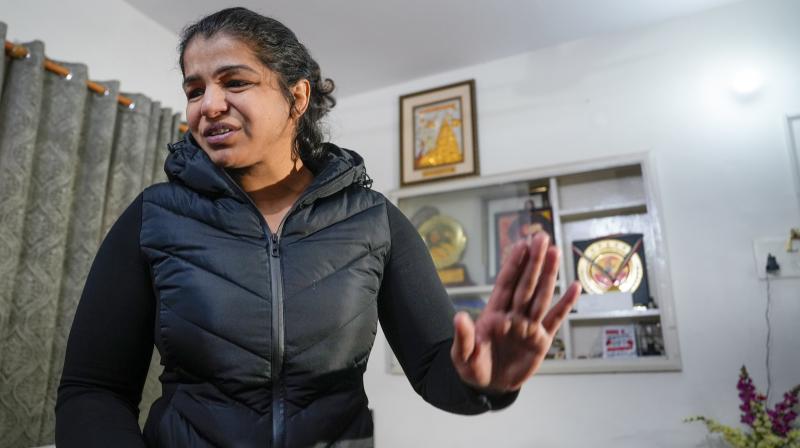 New Delhi: Wrestler Sakshi Malik addresses the media at her residence in New Delhi, Jan. 3, 2024. (PTI Photo/Arun Sharma)