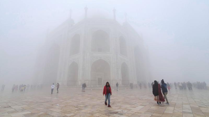 Agra: Visitors at the Taj Mahal amid fog on a cold winter morning, in Agra, Saturday, Jan. 6, 2024. (PTI Photo) 