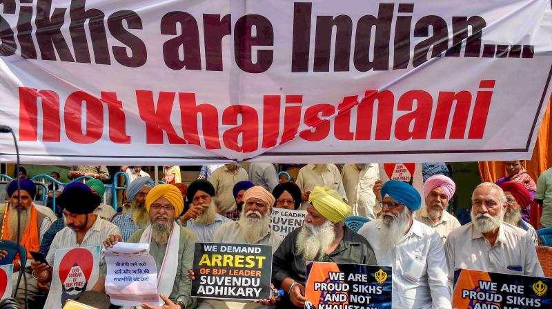 Kolkata: Peoples from the Sikh community stage a protest against BJP leader Suvendu Adhikari after he allegedly called a Sikh IPS officer 'Khalistani', outside BJP office, in Kolkata, Wednesday, Feb. 21, 2024. (PTI Photo) Kolkata: Peoples from the Sikh community stage a protest against BJP leader Suvendu Adhikari after he allegedly called a Sikh IPS officer 'Khalistani', outside BJP office, in Kolkata, Wednesday, Feb. 21, 2024. (PTI Photo)
