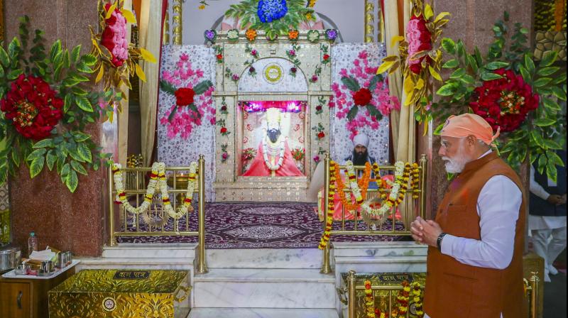 Varanasi: Prime Minister Narendra Modi offers prayers at the Sant Guru Ravidas Janmasthali temple at Seer Govardhanpur on the 647th birth anniversary of Sant Ravidas, in Varanasi, Friday, Feb. 23, 2024. (PTI Photo)