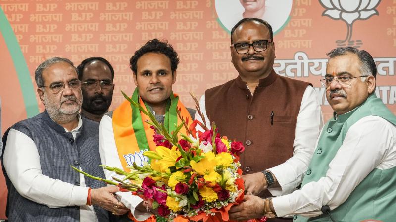 New Delhi: Lok Sabha MP from Ambedkar Nagar Ritesh Pandey joins BJP in presence of UP Dy CM Brajesh Pandey and other BJP leaders, in New Delhi, Sunday, Feb. 25, 2024. (PTI Photo/Kamal Kishore)