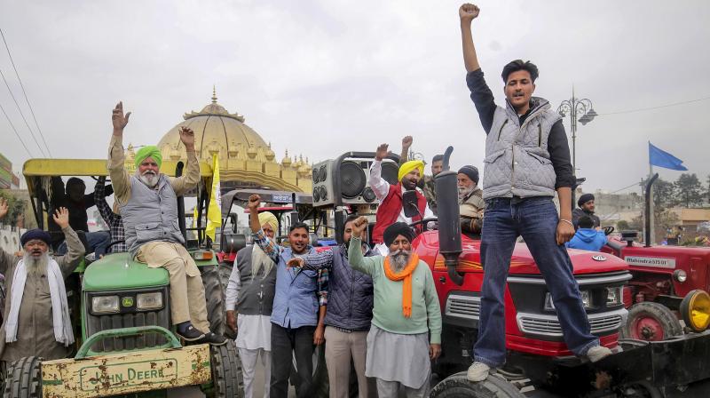Amritsar: Farmers rasie slogans during a tractor rally taken out in support of the farmers' 'Delhi Chalo' protest, in Amritsar, Monday, Feb. 26, 2024. (PTI Photo)