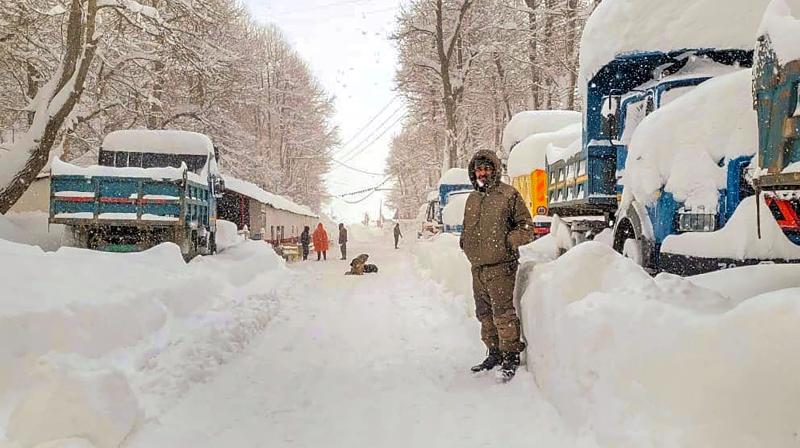 Lahaul and Spiti: Locals at a snow covered road amid snowfall at Sissu, in Lahaul and Spiti district, Sunday, March 3, 2024. (PTI Photo)