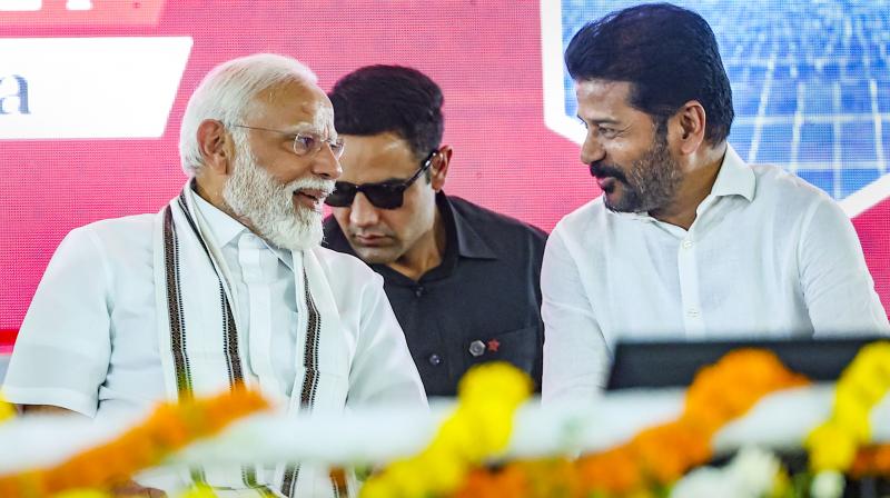 Adilabad: Prime Minister Narendra Modi with Telangana Chief Minister A Revanth Reddy during the launch of development initiatives, in Adilabad, Telangana, Monday, March 4, 2024. (PTI Photo) 