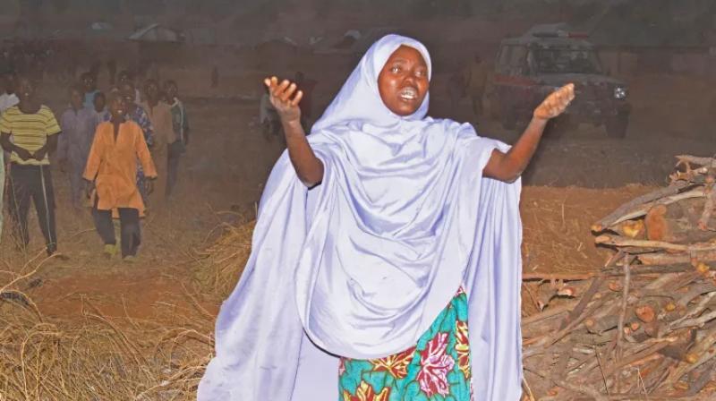 A woman cries as she calls out to the government to help rescue children kidnapped by gunmen in Chikun, Nigeria. A woman cries as she calls out to the government to help rescue children kidnapped by gunmen in Chikun, Nigeria.