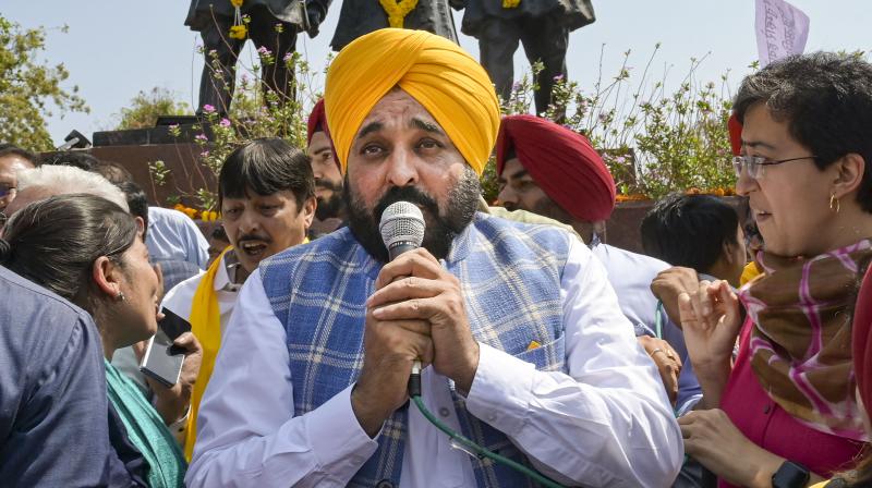 New Delhi: Punjab Chief Minister Bhagwat Mann addresses AAP workers and supporters during a protest over the arrest of Delhi Chief Minister Arvind Kejriwal, at Shaheedi Park, in New Delhi, Saturday, March 23, 2024. (PTI Photo)