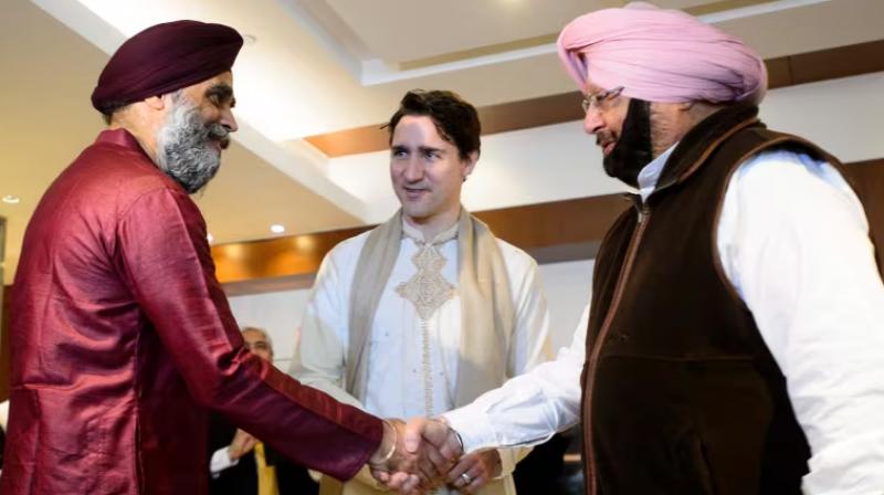 Capt. Amrinder Singh with Harjit Sajjan and Justin Trudeau Capt. Amrinder Singh with Harjit Sajjan and Justin Trudeau