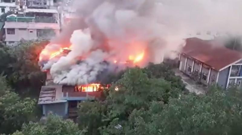 Imphal: Smoke billows after a fire broke out at an abandoned building near Manipur Chief Minister N. Biren Singh's official bungalow, in Imphal, Saturday, June 15, 2024. (PTI Photo) Imphal: Smoke billows after a fire broke out at an abandoned building near Manipur Chief Minister N. Biren Singh's official bungalow, in Imphal, Saturday, June 15, 2024. (PTI Photo)