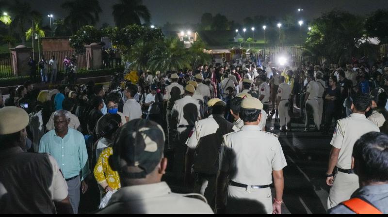 New Delhi: Security personnel keep vigil as climate activist Soman Wangchuk and other Ladakhis, under police detention for the past two days for violating prohibitory orders during their 'Delhi Chalo Padyatra', were taken to Rajghat on Gandhi Jayanti, in New Delhi, Wednesday, Oct 2, 2024. (PTI Photo/Kamal Singh) New Delhi: Security personnel keep vigil as climate activist Soman Wangchuk and other Ladakhis, under police detention for the past two days for violating prohibitory orders during their 'Delhi Chalo Padyatra', were taken to Rajghat on Gandhi Jayanti, in New Delhi, Wednesday, Oct 2, 2024. (PTI Photo/Kamal Singh)