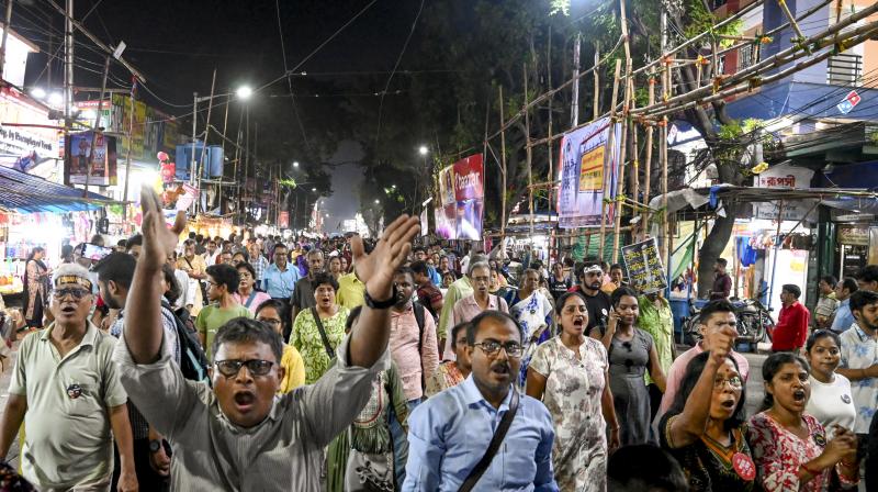 Kolkata: Junior doctors and others take part in a protest march over the alleged sexual assault and murder of a trainee doctor, in Kolkata, Saturday, Oct. 19, 2024. (PTI Photo) Kolkata: Junior doctors and others take part in a protest march over the alleged sexual assault and murder of a trainee doctor, in Kolkata, Saturday, Oct. 19, 2024. (PTI Photo)