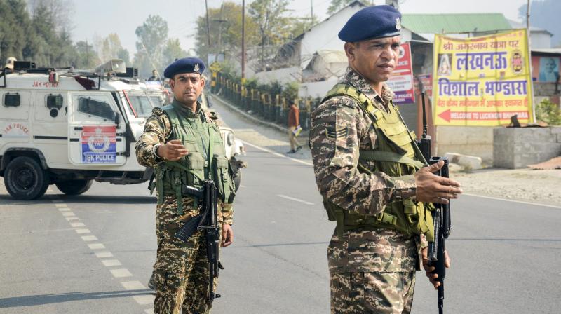 Ganderbal: Security personnel stand guard during a search operation on Srinagar-Ladakh highway following a terrorist attack, in Ganderbal district, Jammu & Kashmir, Monday, Oct. 21, 2024. A doctor and six labourers were killed in the terror attack on Sunday, according to officials. (PTI Photo) Ganderbal: Security personnel stand guard during a search operation on Srinagar-Ladakh highway following a terrorist attack, in Ganderbal district, Jammu & Kashmir, Monday, Oct. 21, 2024. A doctor and six labourers were killed in the terror attack on Sunday, according to officials. (PTI Photo)