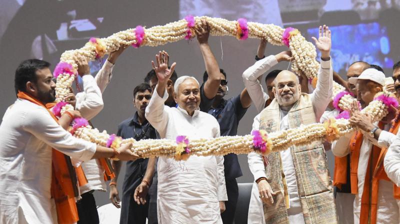Patna: Union Home Minister Amit Shah along with Bihar Chief Minister Nitish Kumar being garlanded at a state-level cooperative conference, in Patna, Sunday, March 30, 2025. (PTI Photo) (PTI03_30_2025_000071A) Patna: Union Home Minister Amit Shah along with Bihar Chief Minister Nitish Kumar being garlanded at a state-level cooperative conference, in Patna, Sunday, March 30, 2025. (PTI Photo) (PTI03_30_2025_000071A)