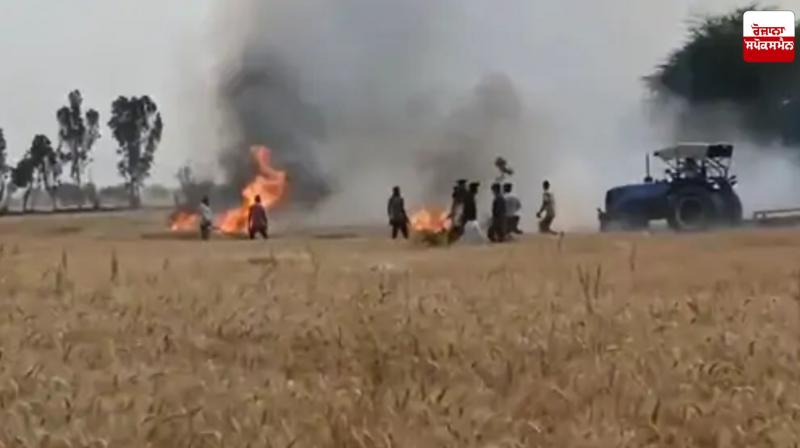Farmer controlling fire with tractor Farmer controlling fire with tractor