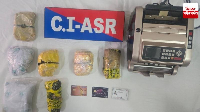Image of 5 kg heroin, 1 currency counting machine and other items seized during the raid. Image of 5 kg heroin, 1 currency counting machine and other items seized during the raid.