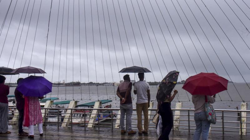 Kochi: Visitors at the Rainbow Bridge amid rainfall, in Kochi, Kerala, Saturday, June 14, 2025. (PTI Photo) Kochi: Visitors at the Rainbow Bridge amid rainfall, in Kochi, Kerala, Saturday, June 14, 2025. (PTI Photo)