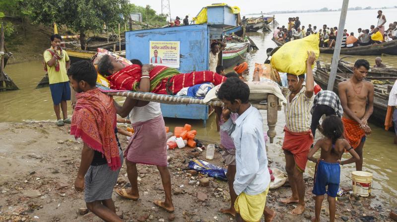 Patna: A sick woman being evacuated from a flood-affected area as the water level of the Ganga river continues to rise during the monsoon season, in Patna, Monday, Aug. 11, 2025. (PTI Photo) Patna: A sick woman being evacuated from a flood-affected area as the water level of the Ganga river continues to rise during the monsoon season, in Patna, Monday, Aug. 11, 2025. (PTI Photo)