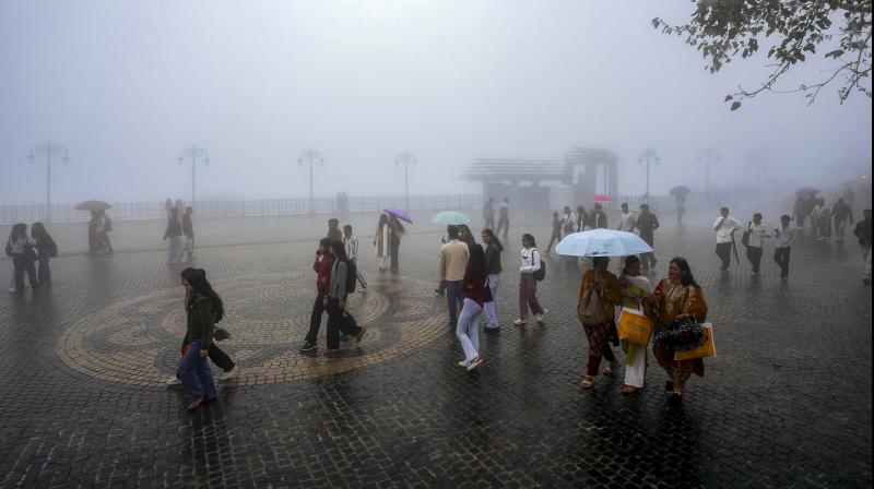 Shimla: People take a walk on a misty afternoon during rain, in Shimla, Himachal Pradesh, Saturday, Sept. 13, 2025. (PTI Photo) Shimla: People take a walk on a misty afternoon during rain, in Shimla, Himachal Pradesh, Saturday, Sept. 13, 2025. (PTI Photo)