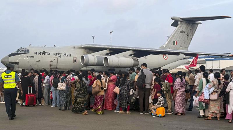 Indian nationals stranded in cyclone-hit Sri Lanka being evacuated by the Indian Air Force (IAF). (PTI Photo)