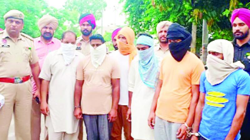 Police officer with arrested accused Police officer with arrested accused