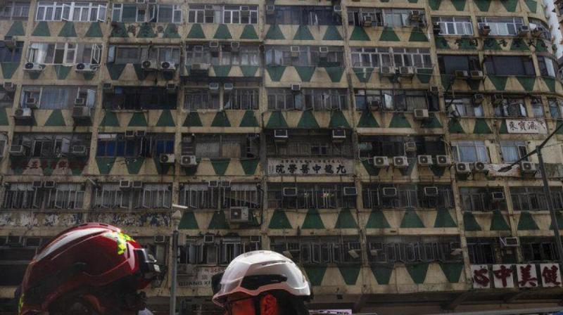 Residential building fire in Hong Kong kills five, injures dozens