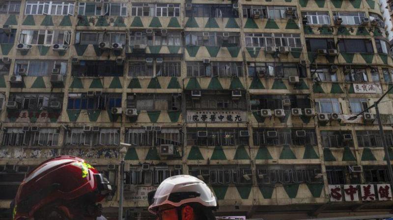 Residential building fire in Hong Kong kills five, injures dozens Residential building fire in Hong Kong kills five, injures dozens