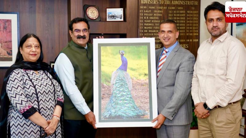 State Information Commissioner Harpreet Sandhu presents his artwork to the UT Chief Secretary State Information Commissioner Harpreet Sandhu presents his artwork to the UT Chief Secretary