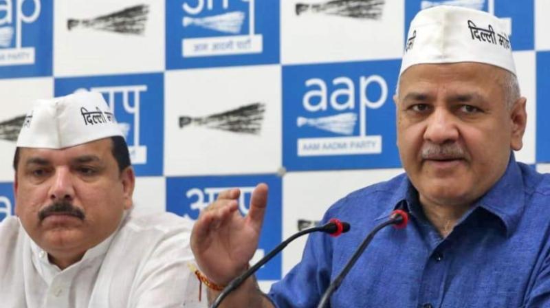 AAP leader Manish Sisodia along with MP Sanjay Singh addresses the media at the party office in New Delhi