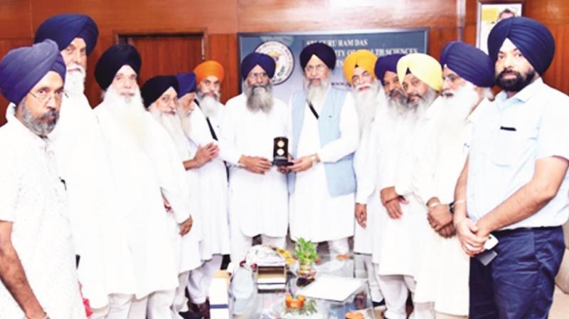 Bhai Gobind Singh Longowal and others launch coins Bhai Gobind Singh Longowal and others launch coins