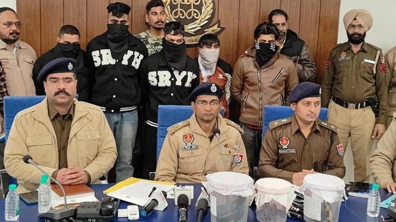 SSP Bhagirath Singh Meena (C) and others with the accused and the pistols seized by police