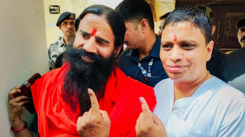 Ramdev, Patanjali's Acharya Balkrishna Cast Their Votes Ramdev, Patanjali's Acharya Balkrishna Cast Their Votes