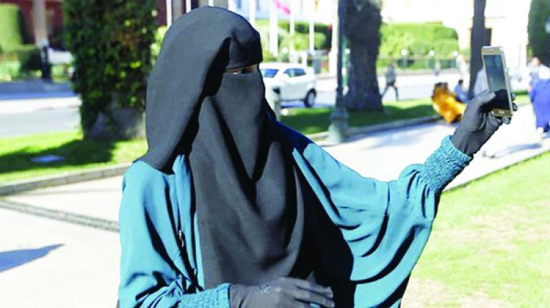 Police fines women  for wearing worn Burka