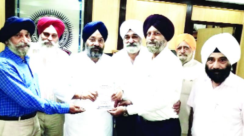 Giving  Invitation to Manjit Singh GK