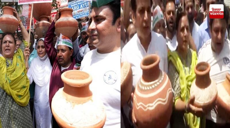 Matka phod protest against aap in delhi over water crisis Matka phod protest against aap in delhi over water crisis