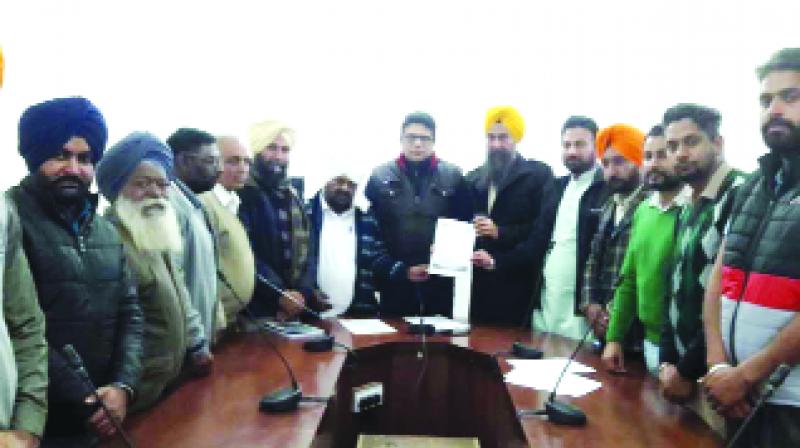 Gurpreet Chandbaja and others submitting memorandum to the Dept Commissioner 