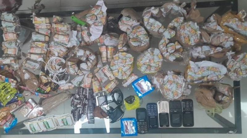 Amritsar police recovered mobile phones, chargers, heater springs and large quantities of beedis, cigarettes and other drugs. Amritsar police recovered mobile phones, chargers, heater springs and large quantities of beedis, cigarettes and other drugs.